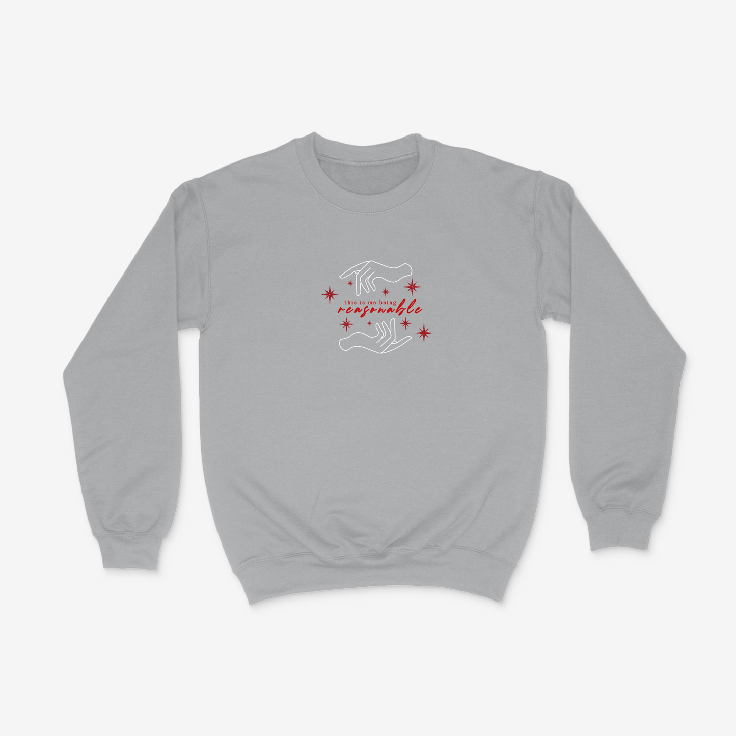Grey crewneck sweater featuring hand design, sparkly red stars, and the phrase "This is me being resasonable" .