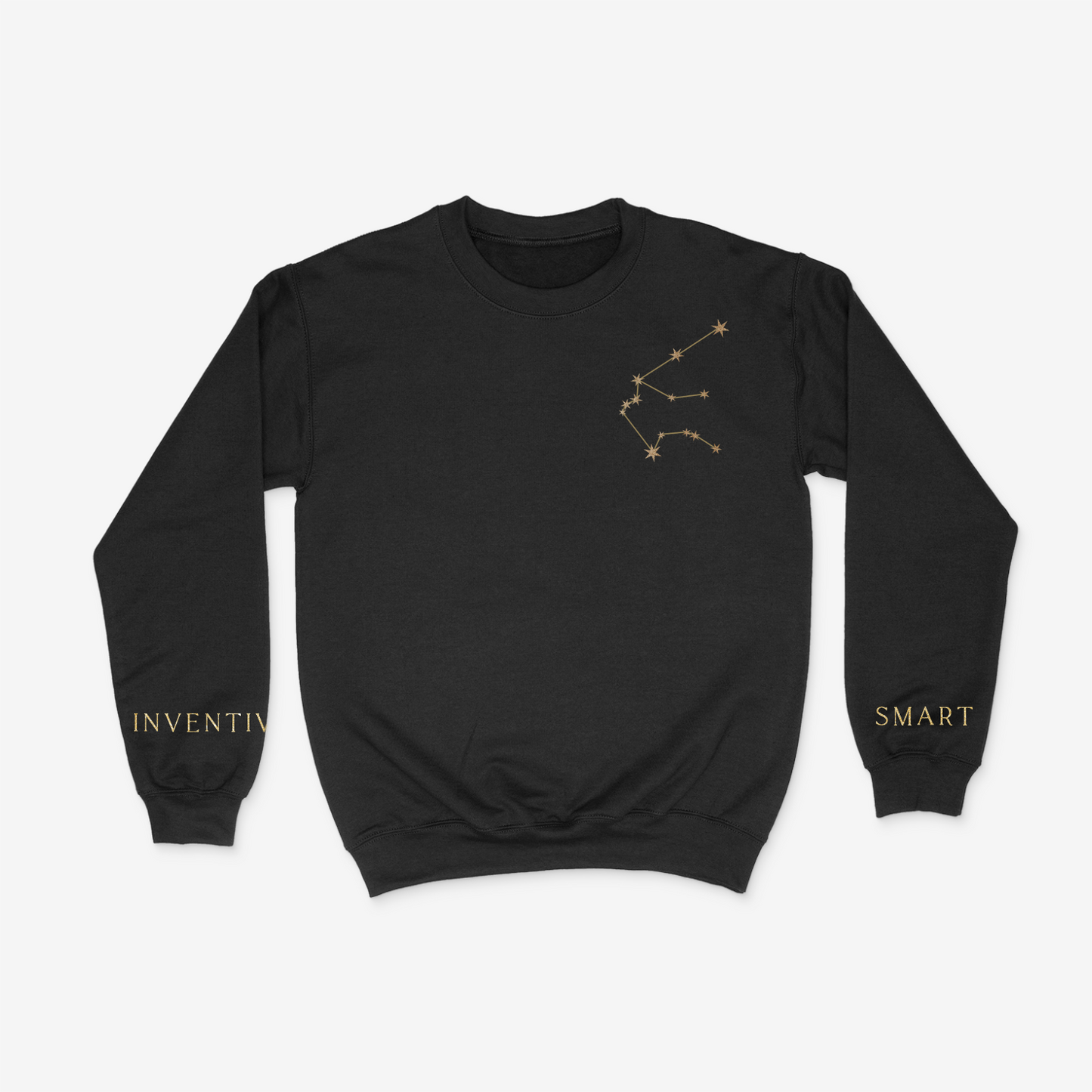 Black crewneck sweater with gold aquarius constellation on upper right chest pocket area and "smart" and "inventive" written on the wrists of either sleeve