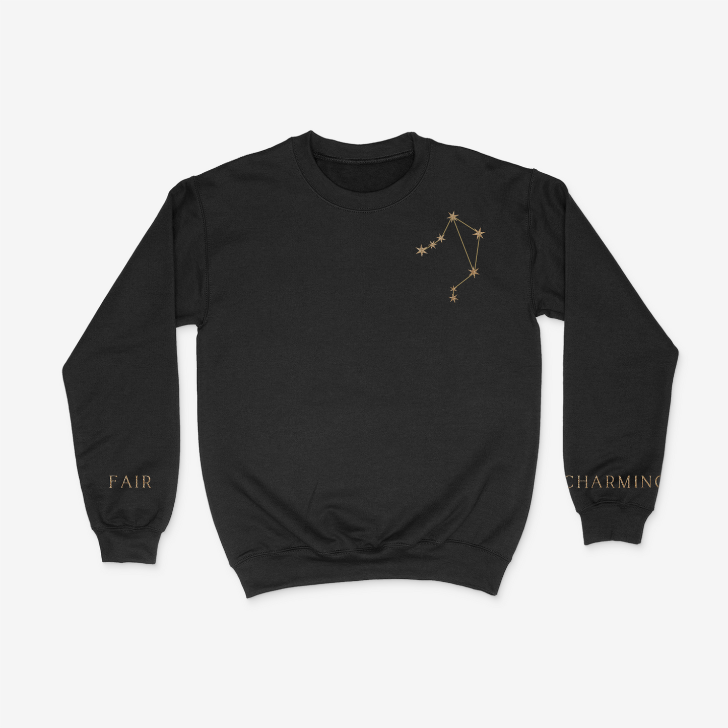 Black crewneck sweater with gold Libra constellation on upper right chest pocket area and "fair" and "charming" written on the wrists of either sleeve