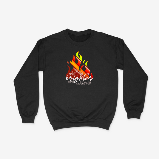 Black crewneck with a red and orange holographic flame design and the phrase "The fire inside burns brighter than the flames around you".